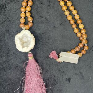 NWT Tommy Bahama crystal rock necklace with wooden beads and tassel.